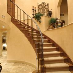 a large foyer with stairs and chandelier