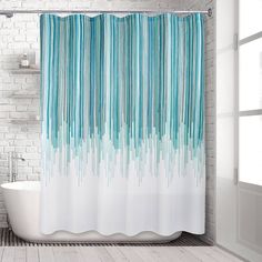 a shower curtain with blue and white stripes on it in a bathroom next to a bathtub