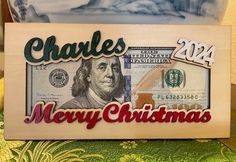 a dollar bill with the words charles merry christmas on it