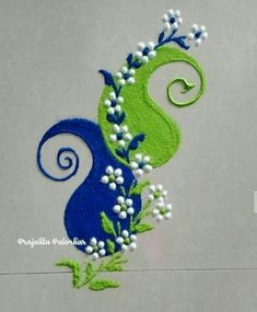 a blue and green design with white flowers