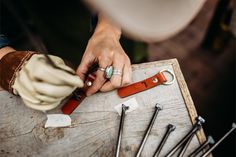 a person is working with some tools on a table