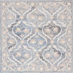 a blue and beige rug with an ornate design