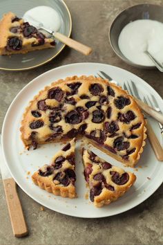 a pie on a plate with one slice cut out