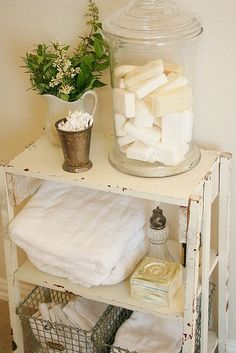 there is a jar full of marshmallows on the shelf next to a bed