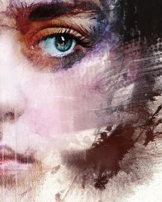 a woman's blue eyes are shown in this artistic photo with grungy paint