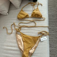 Kendall And Kylie Swimsuit Bikini Sparkle Gold Top Is A Medium Bottom Is A Large Never Been Worn With Tags Pet Free And Smoke-Free Home Gold One-piece Swimwear For Poolside, Gold Backless Swimwear For Pool, Gold Backless Swimwear For Party, Gold Backless Party Swimwear, Gold Lined Swimwear For Party, Gold Fitted Swimwear With Lined Body, Fitted Gold Swimwear With Lined Body, Gold Party Swimwear With Lined Body, Gold Lined Party Swimwear