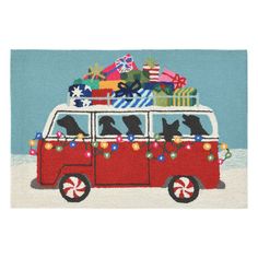 a red van filled with presents and black dogs