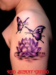 a woman with a butterfly tattoo on her arm and purple water lily in the foreground