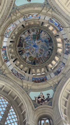 the inside of a large building with many paintings on it's walls and ceiling