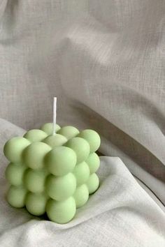 picture of sage green bubble candle with a background of white cloth Cute Room Decor Sage Green, Sage Green Candle Aesthetic, White And Green Clean Aesthetic, Matcha Room Decor, Green Gifts Aesthetic, Aesthetic Green Decor, Sage Green Aesthetic Decor, Sage Green Room Decor Amazon, Sage Green Aesthetic Room Decor