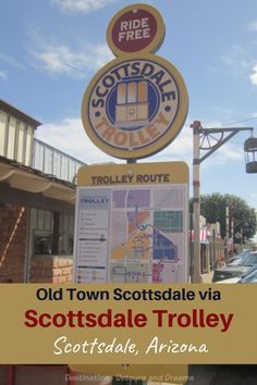 the sign for scottdale trolley sits in front of a building with a sky background