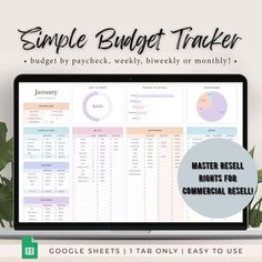 a laptop computer sitting on top of a desk with the words simple budget tracker in front of it