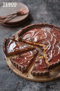 a chocolate tart with one slice cut out