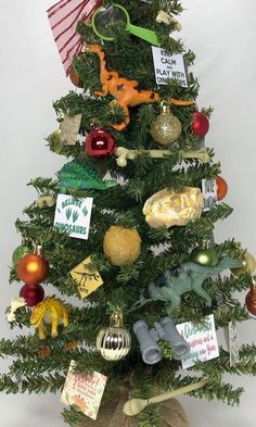 a small christmas tree with ornaments on it