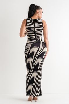 Maxi length Abstract print Back zipper closure 100% Rayon (Stretchy) Model's height: 5'8" Model is wearing size S