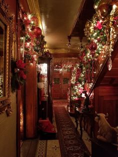 a hallway decorated with christmas lights and garlands