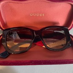 These Are Brand New, Never Worn Gucci Sunglasses. The Front Is A Simple, Classic Gucci Frame. The Sides Have Creme, Navy Blue, And Deep Red Stripes As Well As The Classic Gucci Double G Logo In Gold. The Glasses Come With A Gucci Dust Bag, Gucci Lens Cloth, And A Velvet Gucci Sunglass Case. I'm Open To Offers, So Name Your Price! Thanks For Shopping! *The Sunglasses Do Not Come With Any Tags.* Designer Sunglasses With Tinted Lenses For Formal Occasions, Gucci Brown Sunglasses For Party, Brown Gucci Sunglasses For Party, Designer Acetate Sunglasses For Formal Wear, Designer Acetate Sunglasses For Formal Occasions, Designer Gucci Sunglasses With Uva Protection, Designer Sunglasses With Gradient Lenses, Gucci Frames, Gucci Accessories