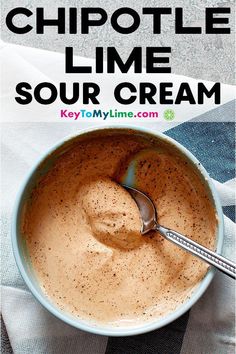 a bowl of soup with a spoon in it and the words chipotle lime sour cream