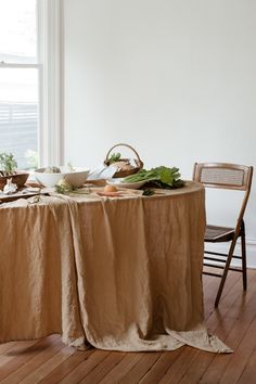 the table is set with plates and bowls on it