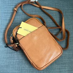 Brand New With Tag Phone Crossbody Bag Purse Genuine Leather Cognac Color Long Adjustable Strap Exterior Slip Pocket Two Zipper Compartments Lined Interior One Dip Pocket Ten Credit Card Slip Pockets Approximate Measurements: 4.5"L X 7.5"H X 1.5"W Durable Trendy Bag Made In Portugal Please See My Entire Collection Soft Leather Phone Bag Pouch For On-the-go, On-the-go Soft Leather Pouch Phone Bag, Travel Crossbody Pouch In Soft Leather, Classic Pouch For Mobile Phone Everyday Use, Classic Mobile Phone Pouch For Everyday Use, Cognac Color, Small Crossbody Bag, Small Crossbody, Crossbody Shoulder Bag