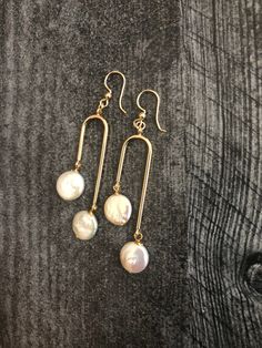 Arch Earrings Gold, Pearl Drop Earrings, Modern Earrings Statement, Bohemian Jewelry, Gift for girlfriend Arch earrings will add a perfect touch of flair to your outfit! These modern earrings are made from: - 18K Gold plated connectors - White freshwater coin pearls - about 10mm - Gold Filled ear wires- lever back or French hook -please pick from drop-down menu Freshwater pearls are slightly different in size, so it makes every pair unique. Arch earrings are 2 7/8 inches long and light. They wil Long Drop Brass Earrings For Wedding, Adjustable Pearl Drop Earrings For Jewelry Making, Single Dangle Brass Pearl Earring, Adjustable Dangle Pearl Earrings, Dainty Brass Pearl Drop Earrings, Adjustable Dangle Pearl Earrings With Ear Wire, Bohemian Pearl Wedding Earrings With Ear Wire, Dangle Brass Pearl Earrings, Nickel Free Dangle Pearl Earrings For Party