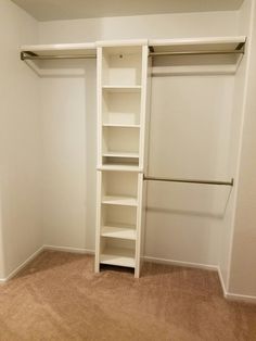 an empty closet with white walls and shelving unit in the corner, next to a carpeted floor