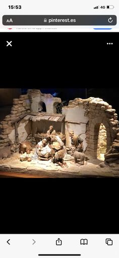 the nativity scene is being displayed on an iphone screen, and it appears to be made out of clay