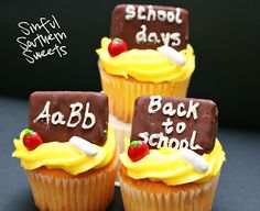 three decorated cupcakes with writing on them