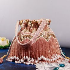 About This Item Introducing THE TAN CLAN Embroidered Embellished Potli Bag--a premium accessory designed to elevate your style for any special occasion. This luxurious drawstring purse is the perfect addition to your collection, ideal for weddings, festive celebrations, Diwali, New year, Christmas, bridesmaid, anniversary, engagements, baby shower and other significant events. Description: THE TAN CLAN Embellished Potli Clutch | Premium Women Pouch | Elegant Wedding Purse for Girls | Luxurious D Moti Bags, Potli Purse, Drawstring Purse, Embroidered Clutch, Potli Bags, Wedding Purse, Luxury Gift Box, Pouch Bag, Flap Bag