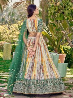 Introducing the stunning "great white & green shibori printed chinon lehenga choli with dupatta" from Ethnic Plus! This exquisite set features a white and green color combination, crafted from premium chinon material. The lehenga is adorned with intricate zari embroidered work, sequin work, and beautiful shibori print details, making it a show-stopping ensemble for weddings, festivals, and other ethnic occasions.
With its semi-stitched design, it can fit up to 42 inches and comes with an uns Chinon Lehenga, Green Shibori, Green Color Combination, Engagement Gown, Wedding Salwar Kameez, Lehenga Crop Top, Green Color Combinations, Choli Dress, Lehenga Choli Wedding