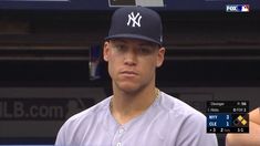 a baseball player wearing a new york yankees uniform