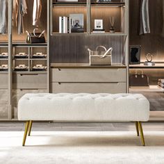 a white bench sitting in front of a walk in closet