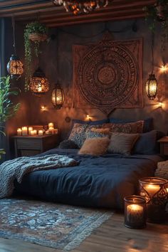 a bedroom with candles lit up on the wall and a large tapestry hanging over the bed