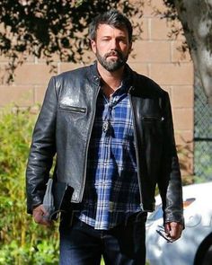 Ben Affleck Black Biker Leather Jacket Ben Affleck's casual yet refined style has been making the rounds on the internet, inspiring fashion enthusiasts all over the world. Showcasing a blend of classic yet modern aesthetics paired with neutral-tone pieces makes Ben’s style truly approachable, giving it a relaxed appearance. Inspired by his style, we are introducing the Ben Affleck black leather jacket for all our bikers and fashion fanatics wishing to channel this style. Crafted with genuine leather, the black biker jacket exudes urban chic while maintaining timeless simplicity, making it a must-have for individuals seeking pieces that can be styled for years without having to worry about trends. The interior is constructed from soft viscose, wrapping the wearer in an unparalleled comfort Classic Biker Jacket For Urban Adventures In Fall, Classic Long Sleeve Outerwear For Urban Adventures, Casual Biker Jacket For Business In Winter, Timeless Simplicity, Black Biker Jacket, Biker Leather Jacket, Vinyl Bag, Biker Leather, Refined Style