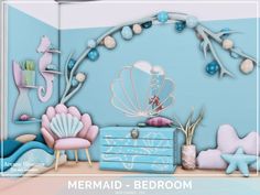 there is a mermaid themed bedroom with blue walls