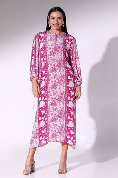 Plum tunic dress with floral print and a buttoned placket.
Components: 1
Pattern: Printed
Type Of Work: Floral
Neckline: Round
Sleeve Type: Balloon
Fabric: Crepe
Color: Purple
Occasion: Resort - Aza Fashions Floral Print Dress For Eid Vacation, Floral Print Vacation Dress For Eid, Floral Print Beach Dress For Eid, Floral Print Tunic Dress, Floral Print Tunic Dress For Daywear, Vacation Tunic Kurta With Floral Print, Vacation Floral Print Tunic Kurta, Long Sleeve Dresses With Printed Motifs For Vacation, Silk Printed Dress For Eid