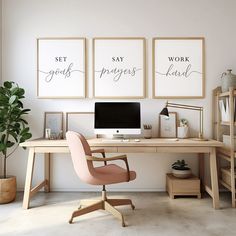 a home office with three posters on the wall and a computer desk in front of it