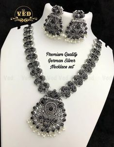 Beautifully ornate with floral motifs , brilliant stones & hanging pearls, this one of a kind necklace set will make you fall in love with it instantly. Handcrafted in german silver with oxidized silver plating , this glorious set has a breathtaking impact of instantly adding glam to your outfits. They look splendid with your sarees , low neck kurtas or even with your lehangas. Temple Jewellery Choker, Indian Jewellery Set, Jewellery Choker, Oxidised Necklace, Oxidized Necklace, Silver Necklace Set, Chic Necklace, Indian Jewelry Sets, South Indian Jewellery