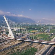 an aerial view of a bridge over a highway