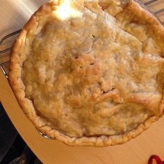 a pie sitting on top of a wooden table