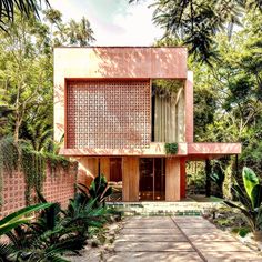 the house is surrounded by trees and plants