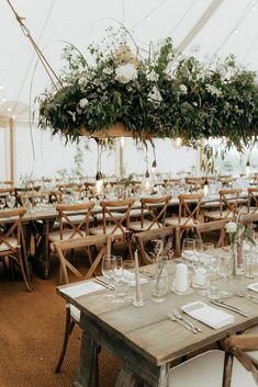 Marquee wedding reception with wooden banquet tables, green foliage hanging installations and fairy light canopy Marquee Flowers, Marquee Wedding Reception, Marquee Wedding Inspiration, Cloud Installation, Marquee Wedding Decoration, Marquee Decoration, Flower Cloud, Boat Wedding, Wedding Canopy