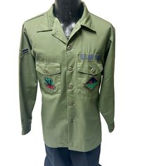 X209 Add me to your Favorites Seller's List Mannequin is a size 38 chest. Features: * Military * patches * Made in Unknown Size: Mens XL Measurements Chest 23 in / 58 cm length 29 in / 74 cm Sleeve 23 in / 58 cm Shoulder 19 in / 48 cm Condition: Pre-Owned Good Article is in excellent condition. Retro Long Sleeve Khaki Top, Retro Khaki Long Sleeve Top, Retro Long Sleeve Khaki Shirt, Uniform Long Sleeve Cotton Tops, Uniform Style Long Sleeve Cotton Tops, Long Sleeve Cotton Uniform Tops, Cotton Long Sleeve Uniform Tops, Retro Green Top With Pockets, Green Long Sleeve Military Style Tops