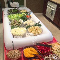 an inflatable buffet table filled with lots of food