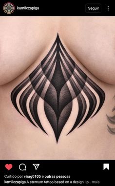 an image of a tattoo on the back of a woman's stomach with black and white lines