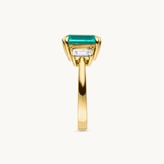 Our Eden Ring symbolizes the green paradise, a place of never-ending bliss and the radiance of positive energy. A 3ct. sparkles in the heart of Eden. lab grown emerald in the eponymous emerald-cut, its presence accentuated by flanking lab-grown baguette-cut diamonds. Framed in 14k recycled gold and carried by a stylishly high-quality double claw setting, EDEN is the central element of our VEYNOU collection.


Metal: 14k recycled yellow gold (white or rose gold also possible on request)
Frame: Do Emerald Jewelry With Trillion Brilliant Cut, Timeless Baguette Cut Green Emerald Ring, Timeless Green Baguette-cut Emerald Ring, Timeless Green Baguette Cut Emerald Ring, Trillion Cut Brilliant Emerald Jewelry, Timeless Emerald Ring With Radiant Cut, Radiant Cut Diamond Ring For May Birthstone, Green Diamond Rings With Trillion Cut, Timeless Asscher Cut Green Emerald Ring