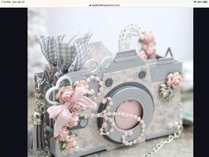 a camera with flowers on it sitting on a table