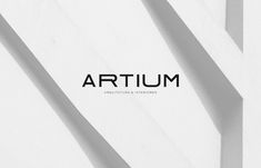 the word artium written in black and white on top of an image of lines