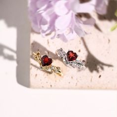 Cue the romance with our stunning Heart’s Desire Red Garnet Ring. This perfect expression of true love features a heart-shaped red garnet center stone along with a curved leafy band that adds a natural charm. A cherished keepsake that radiates love from every angle. ✦ Available in both 14K white gold vermeil (14K white gold plated over a sterling silver base) and 10K solid white gold. Elegant Red Heart Promise Ring, Elegant Red Heart Ring With Birthstone, Ruby Ring For Valentine's Day, Birthstone, Red Heart-shaped Birthstone Ring For Promise, Red Heart-shaped Birthstone Ring For Gift, Red Heart-shaped Birthstone Promise Ring, Elegant Red Heart Birthstone Ring, Elegant Double Heart Birthstone Ring For Valentine's Day, Ruby Heart Birthstone Promise Ring