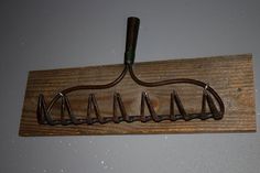 a coat rack with several pairs of scissors hanging from it